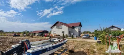 Ferma 3,3ha, din care 2,5ha intravilan, vila 7 camere, D+P+E+M, casa pentru muncitori, grajd animale, livada, culturi porumb si grau, PODISOR/GIURGIU - foto 3