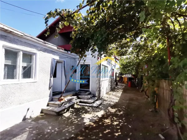 Casă 4 camere Magureni - poza 1