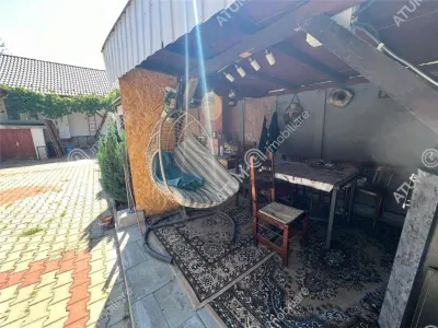 Casa individuala de inchiriat cu 3 camere 3 bucatarii pivnita situata in localitatea Poplaca din Sibiu - foto 13