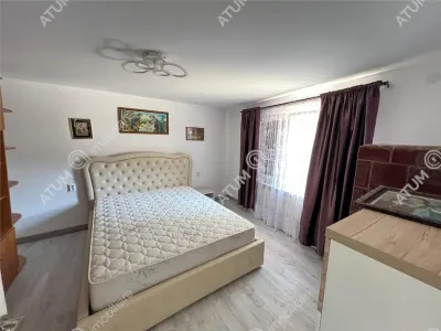 Casa individuala de inchiriat cu 3 camere 3 bucatarii pivnita situata in localitatea Poplaca din Sibiu - foto 3