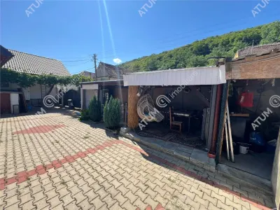Casa individuala de inchiriat cu 3 camere 3 bucatarii pivnita situata in localitatea Poplaca din Sibiu - foto 10