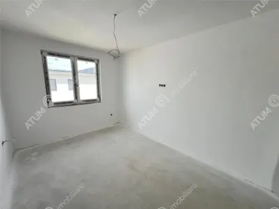 Casa de vanzare cu 4 camere 2 bai 2 balcoane si curte libera de 50 mp situata in zona Calea Cisnadiei din Sibiu - foto 7