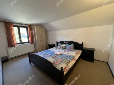 De vanzare pensiune de 7 camere cu 5 bai si teren de 377mp  situata in Paltinis cota 1440 m - foto 6