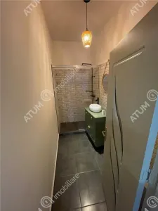 De vanzare apartament cu 2 camere si gradina situat in zona centrala a orasului Cisnadie - foto 10